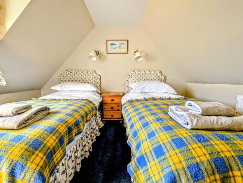 Postel nebo postele na pokoji v ubytování Reids Cottage
