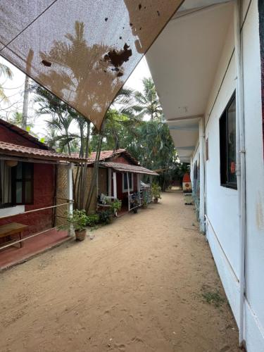 an empty courtyard of a house with a building at SPACELAND Mandrem in Mandrem