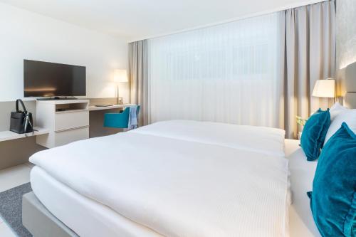 Letto o letti in una camera di CITY STAY - Lindenstrasse