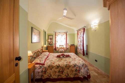 a bedroom with a large bed in a room at Il Mandorlo - Agriturismo e Azienda Agricola Ferrato in Ancona