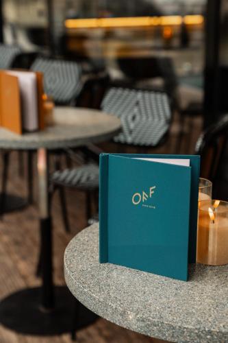 a blue book sitting on top of a table at Hotel OFF Paris Seine in Paris