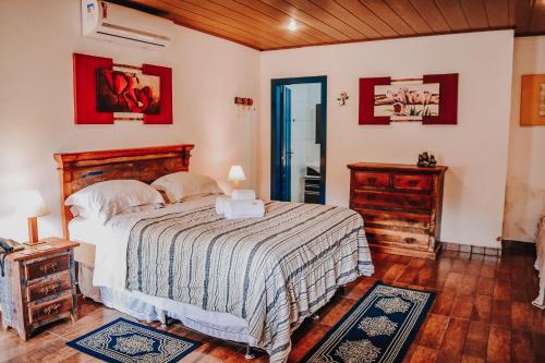 Postel nebo postele na pokoji v ubytování Paraiso da Serra