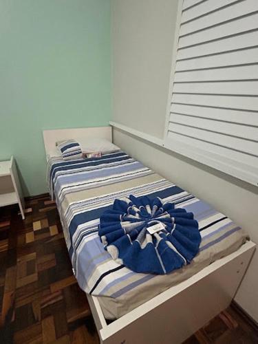 Ένα ή περισσότερα κρεβάτια σε δωμάτιο στο Pousada Irmãs Franciscanas