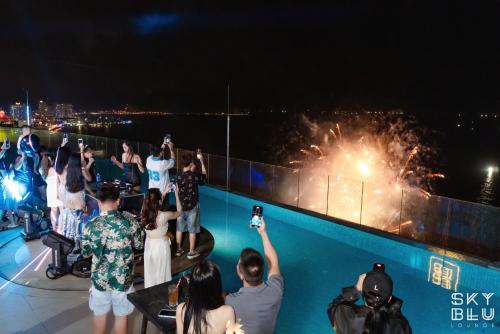 a crowd of people taking pictures of fireworks at Coastal Charm Panorama Bayview in Nha Trang