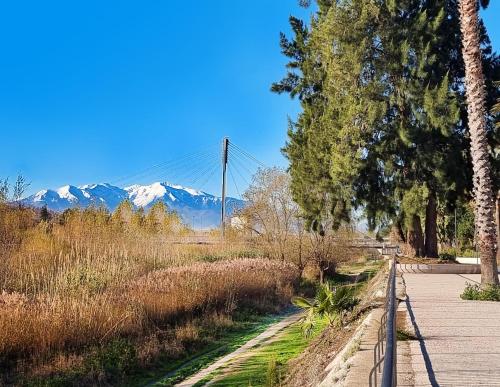 a walking path with a suspension bridge in the distance at ibis budget Perpignan Centre Rénové en 2025 in Perpignan