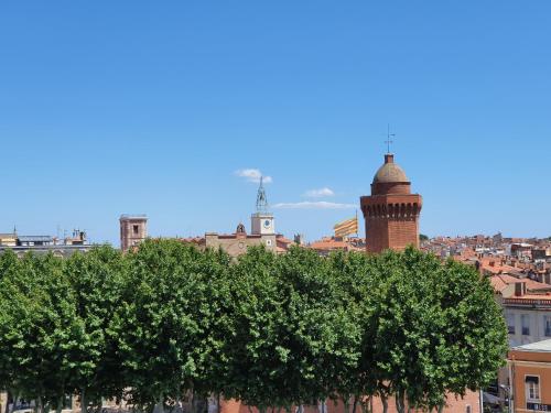 a view of a city with a tree at ibis budget Perpignan Centre Rénové en 2025 in Perpignan