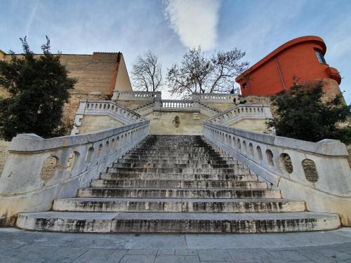 a set of stairs leading up to a building at ibis budget Perpignan Centre Rénové en 2025 in Perpignan