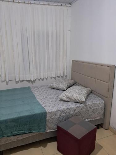 Ένα ή περισσότερα κρεβάτια σε δωμάτιο στο Casa central Balneário Camboriú