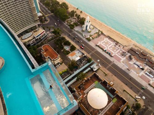 an overhead view of a swimming pool next to a beach at Coastal Charm Panorama Bayview in Nha Trang