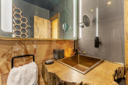 a bathroom with a sink and a wooden table at 2 Bed in Morecambe oc-s33326 in Morecambe