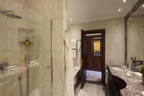 a bathroom with a shower and a sink at Anantara Palazzo Naiadi Rome Hotel - A Leading Hotel of the World in Rome