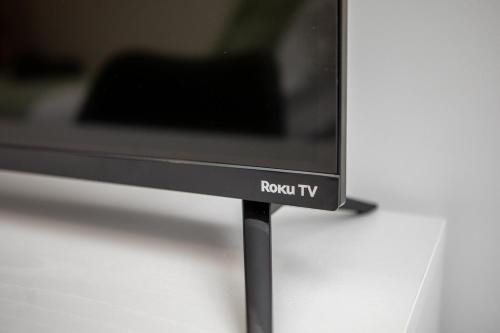 a flat screen tv sitting on top of a table at St James Court Hotel in Derby
