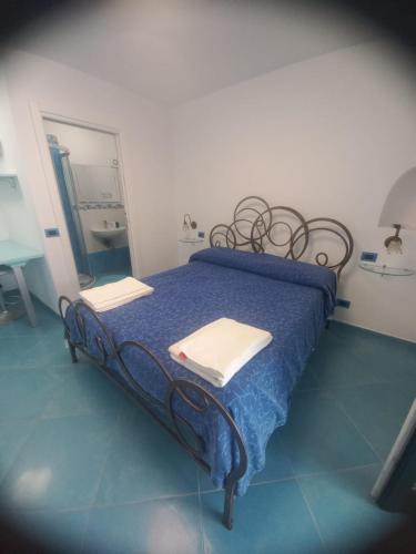 Ένα ή περισσότερα κρεβάτια σε δωμάτιο στο Stella Marina