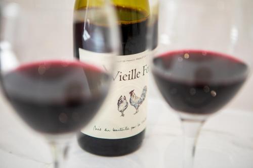 a bottle of red wine and two glasses of red wine at St James Court Hotel in Derby