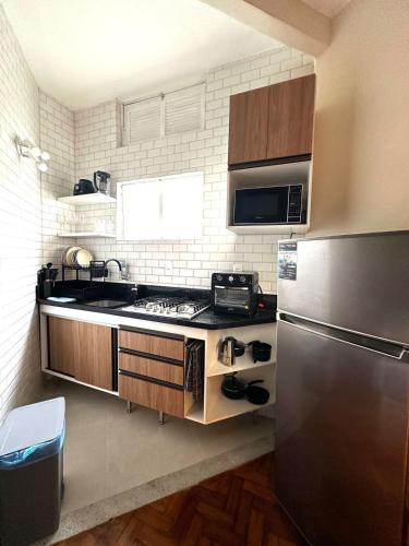 Virtuvė arba virtuvėlė apgyvendinimo įstaigoje Cozy in Glória