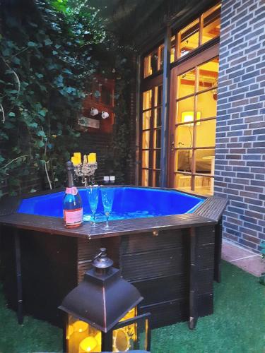 a jacuzzi tub in the backyard of a house at Apartment with terrace in Zeuthen
