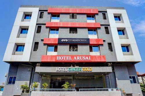 a building with a hotel in front of it at Hotel O Ginger Gold in Lohogaon