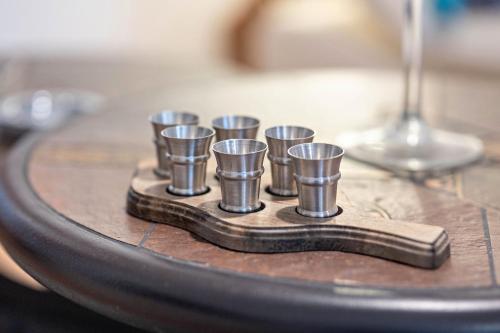 a group of cups sitting on a wooden table at Ferienwohnung Karl-Heinz in Maar
