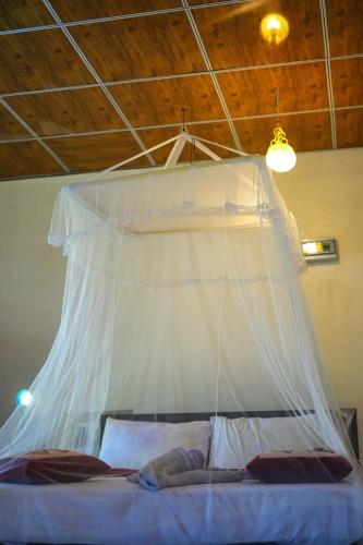 Postel nebo postele na pokoji v ubytování Dulmini Homestay