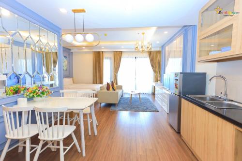 a kitchen and living room with a table and chairs at Căn Hộ FLC SEA TOWER Quy Nhơn View Biển Giá Rẻ in Quy Nhon
