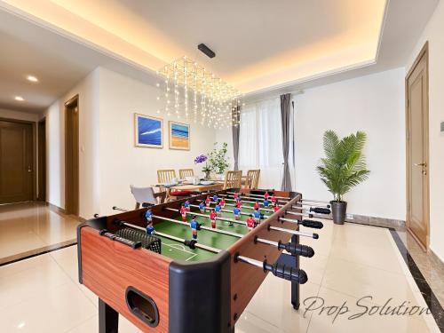 a living room with a foosball table in the middle at Cozy Seaview Suite Johor Bahru CIQ in Johor Bahru