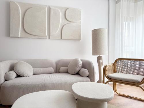 a living room with a couch and a chair at Megara Home in Soria