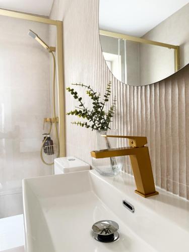a bathroom with a sink and a mirror at Megara Home in Soria