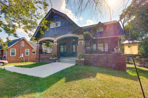a large house with a blue roof at 1 Mi to Dtwn Welcoming Macon Home with Yard in Macon