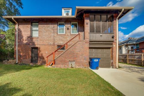 a brick house with a door and a garage at 1 Mi to Dtwn Welcoming Macon Home with Yard in Macon