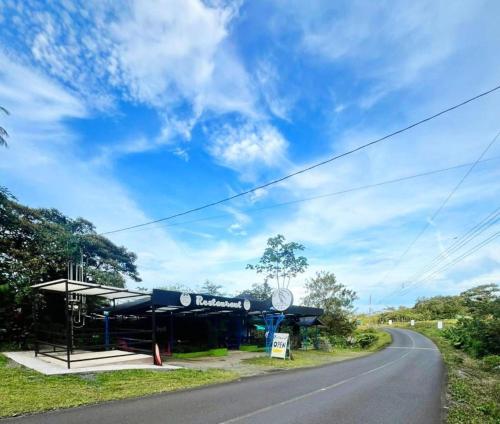 a gas station on the side of a road at Garza del Sol Glamping Bromelia in San Rafael