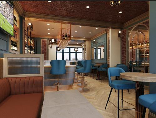 キルケニーにあるThe Tholsel Bar and Townhouse Kilkennyの青い椅子とバーのあるレストラン