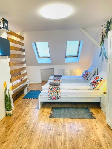 Postel nebo postele na pokoji v ubytování Magenta Apartman