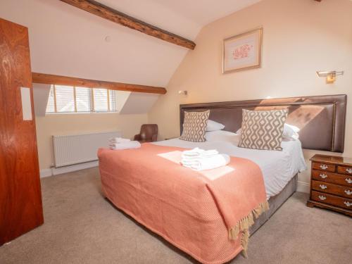 a bedroom with a large bed in a room at The Black Boy Inn in Caernarfon