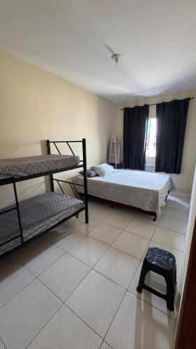 Postel nebo postele na pokoji v ubytování Nosso Cantinho