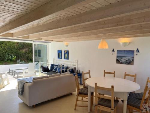 a living room with a couch and a table at AMAZIGH VILLAS - 3 bedrooms, 2 bathrooms in Aljezur