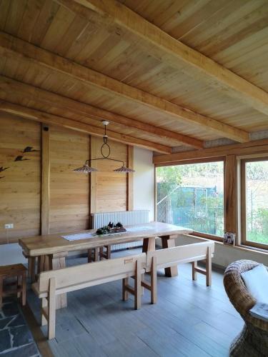 a dining room with a table and benches at B&B Monticelli in Gubbio