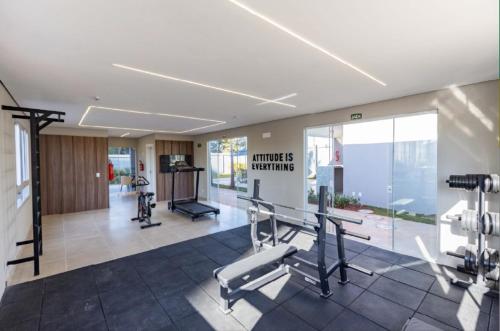 a gym with cardio equipment in a building at Apartamento novo, mobiliado e com ótima localização in Barretos