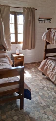 Postel nebo postele na pokoji v ubytování Brisas del Sur Chalet 2