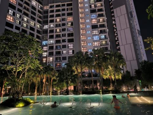 people playing in a pool in a city at night at Travel Malaysia At Agile Bukit Bintang KL in Kuala Lumpur