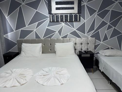 Katil atau katil-katil dalam bilik di Barrudada Palace Hotel-Boa Vista