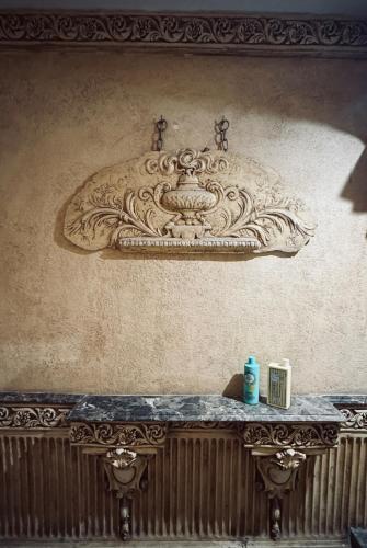 a stone sink on the wall of a room at Modern apartment near AUC - 3BR in Cairo