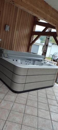 a boat sitting on top of a tile floor at Gîte du pré forestier in Saulxures-sur-Moselotte