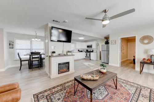 a living room with a table and a fireplace at Amazing House*relax and unwind*5 min to hospitals in Temple