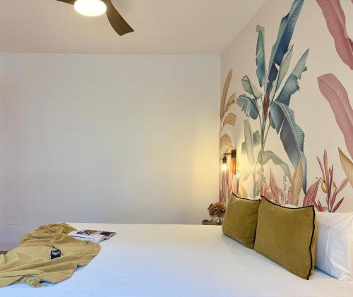 a bedroom with a bed with a mural on the wall at Canaryislandshost l Sal de Mar in Puerto del Carmen