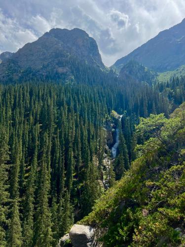 a view of a valley with trees and a river at Guest house and yurt camp Svetlana in Bokonbayevo