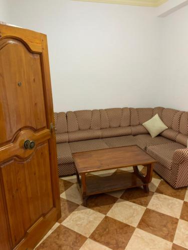 a living room with a couch and a coffee table at Zellaka apartamento2 in Asilah