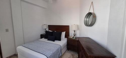 Katil atau katil-katil dalam bilik di Hotel Suites Mar Elena