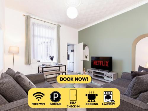 a living room with a couch and a tv at Newly Renovated 3br House Near Hospital & Uni in Sunderland