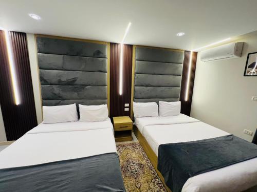 Un ou plusieurs lits dans un hébergement de l'établissement Rehana Pyramids Hotel