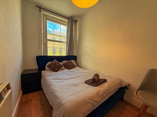 a bedroom with a bed with a hat on it at Newcastle City Centre, Two Bedroom, Sleeps 6 in Newcastle upon Tyne